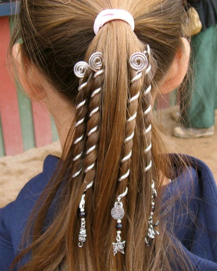 Rear view of model wearing multiple Silver 4-Inch Spiral Hair Twisters with Charms in ponytail