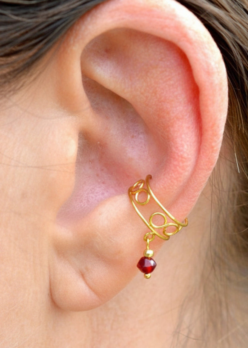 gold organic spiral ear cuff worn on ear non piercing earring side view