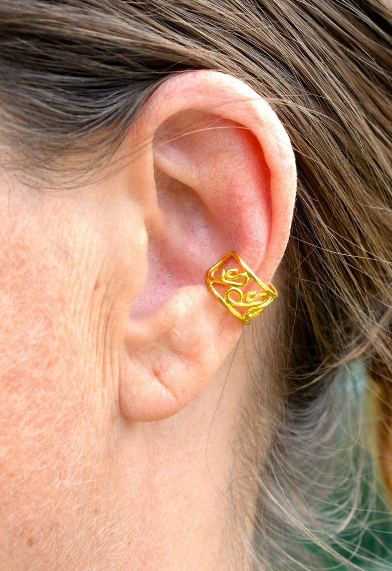 gold organic spiral ear cuff non piercing earring front view