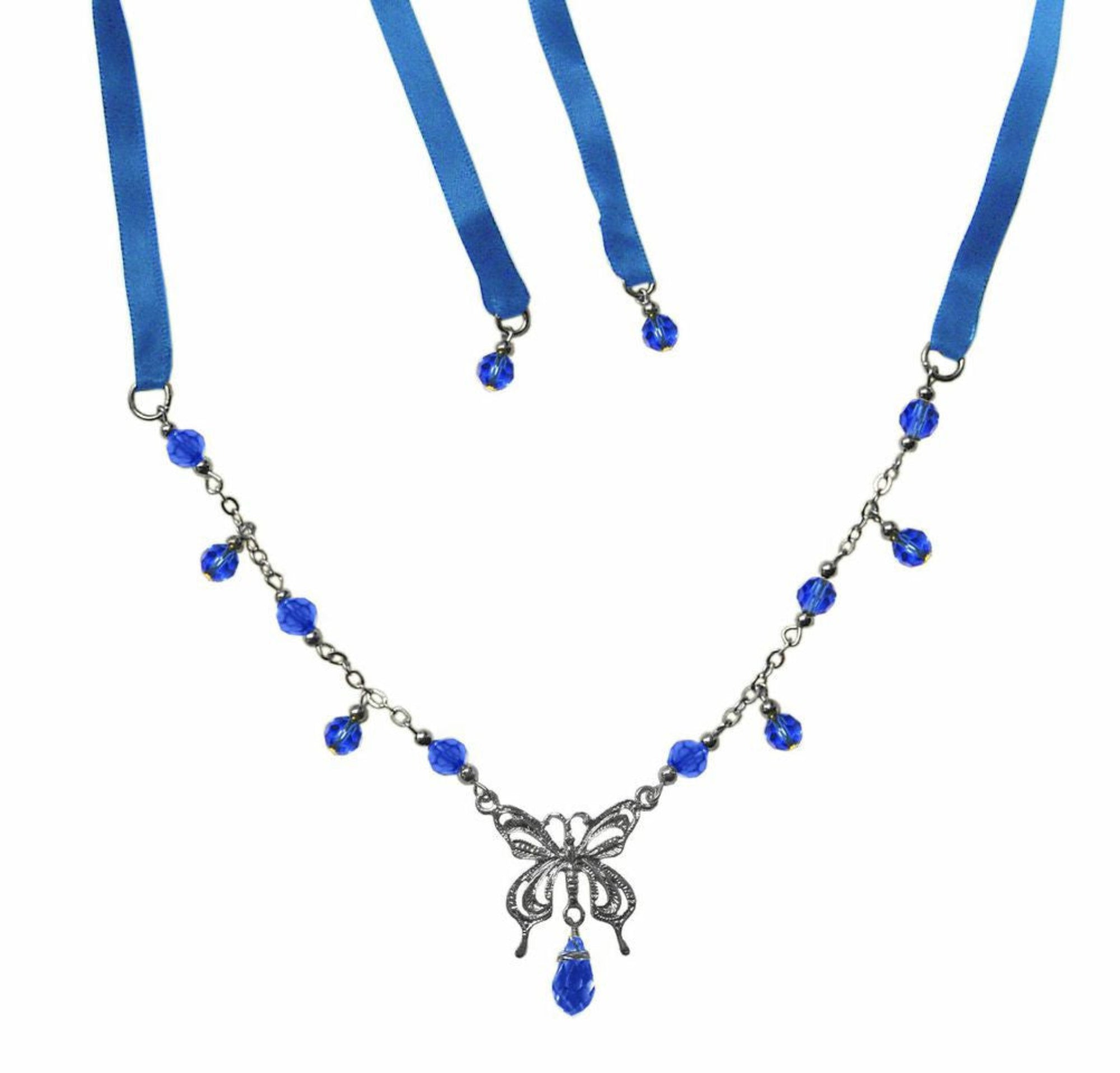 silver necklace with blue beads and butterfly pendant on ribbon