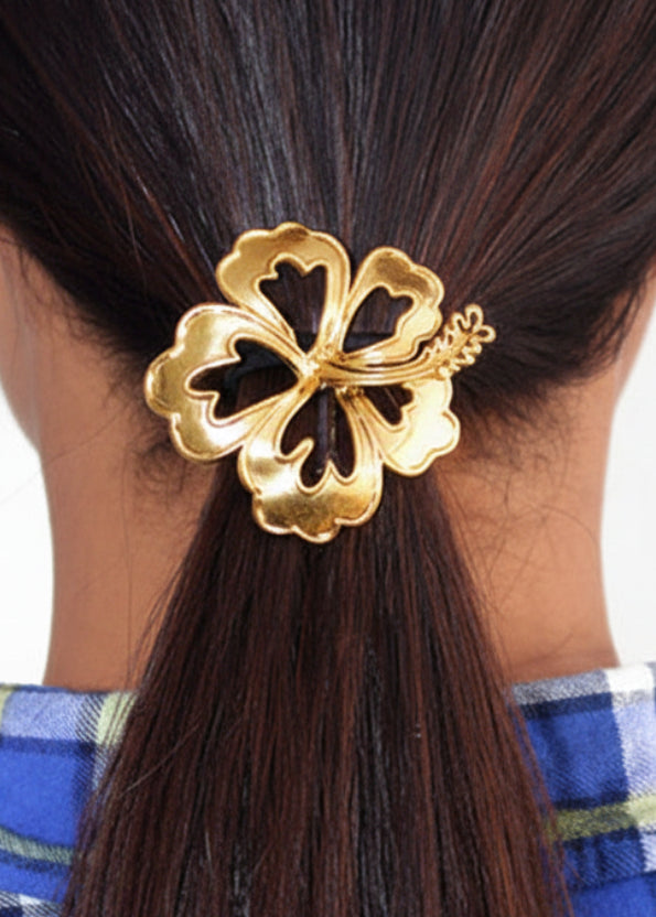 Model wearing Gold Hibiscus Hair Hook - Elegant Boho Ponytail Holder