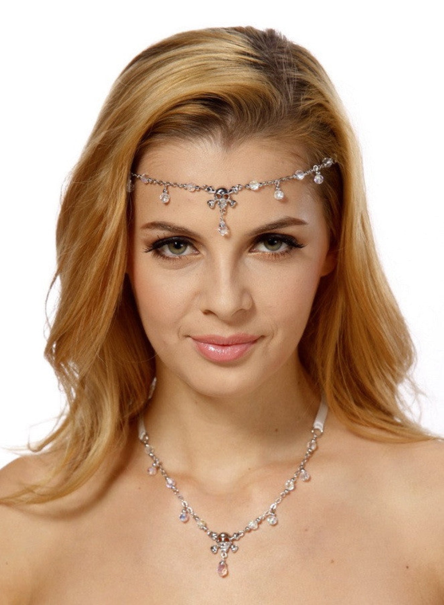Model wearing silver skull and crossbones tie-on crown and matching necklace
