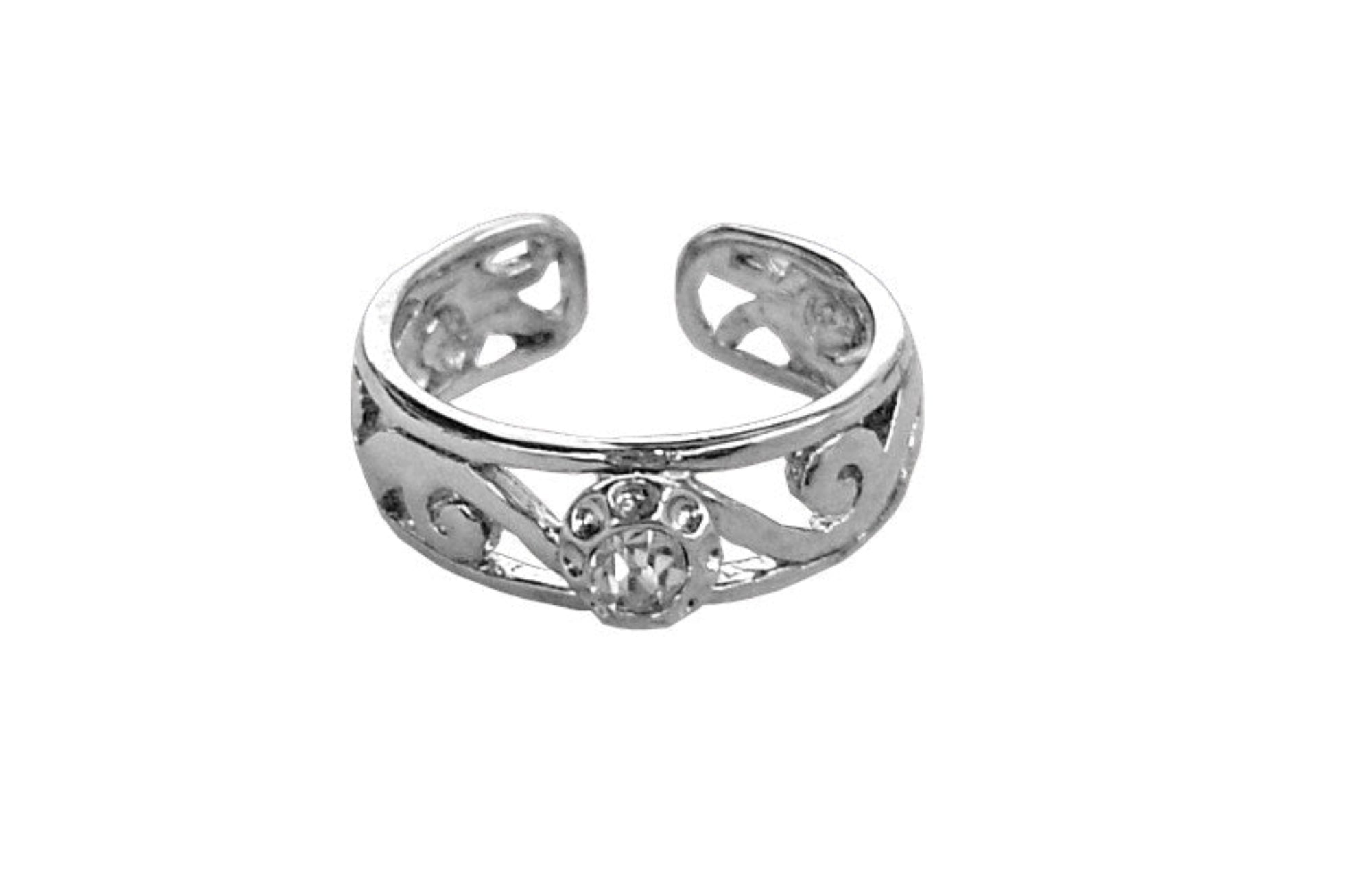 Model wearing spiral band toe ring with gold overlay and red stone