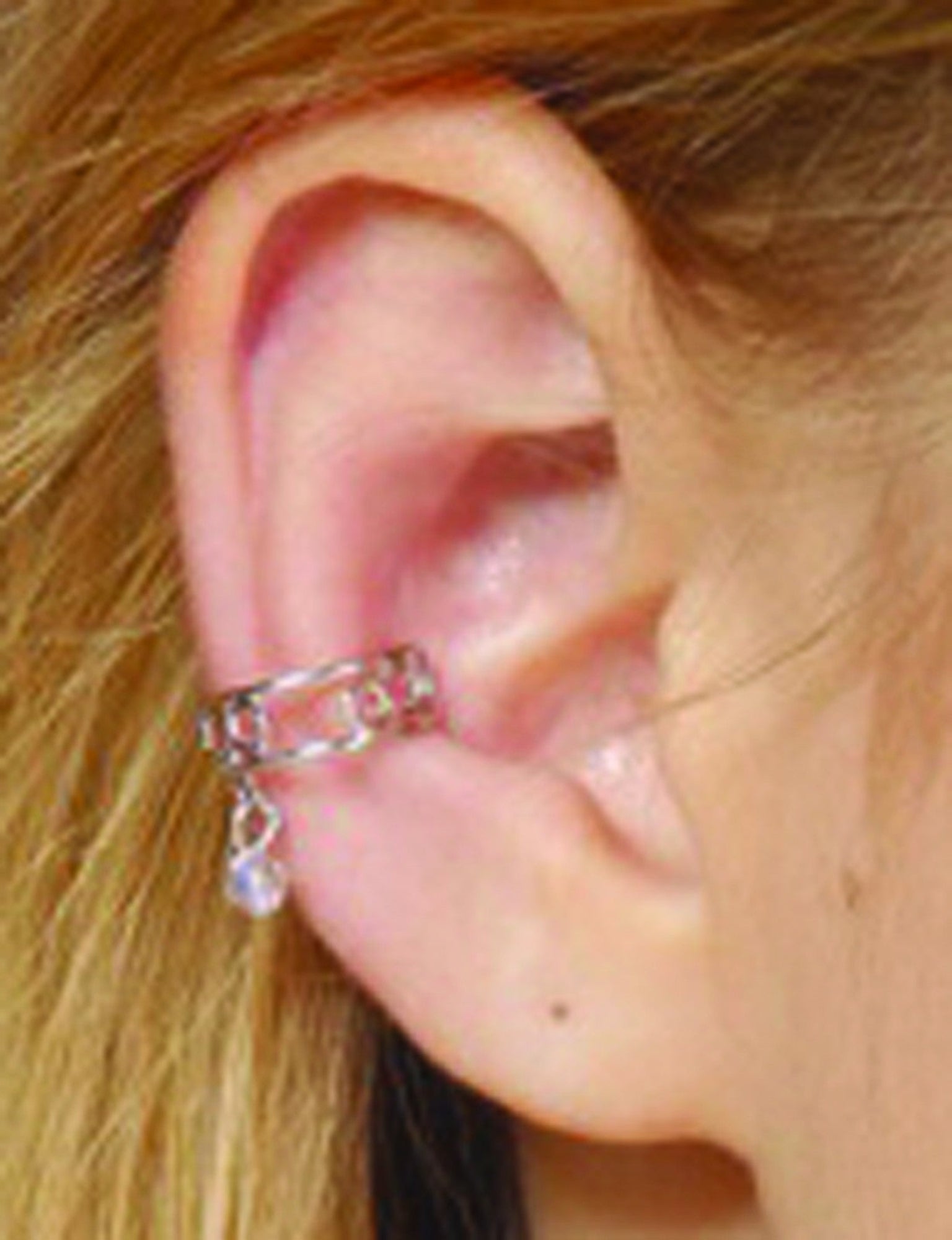 silver ear cuff with dangling blue bead non piercing adjustable jewelry front view